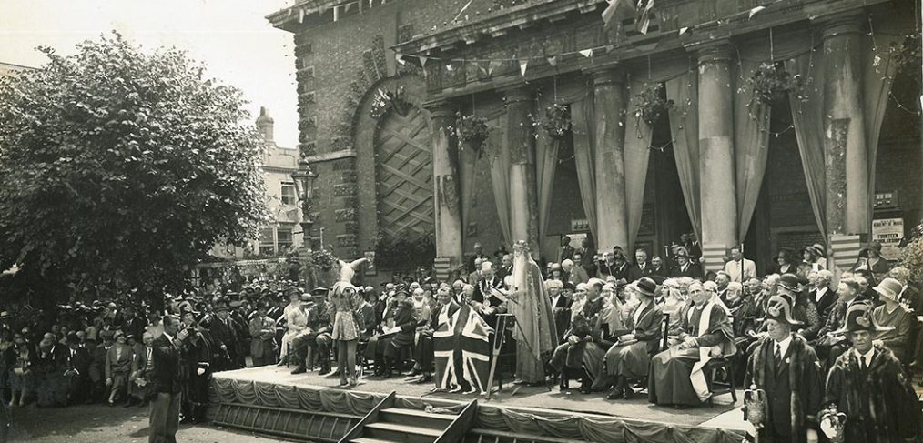 People dressed in carnival costumes on steps of Guildhall, Salisbury 1930