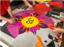 making a Diwali window design with brightly coloured tissue paper