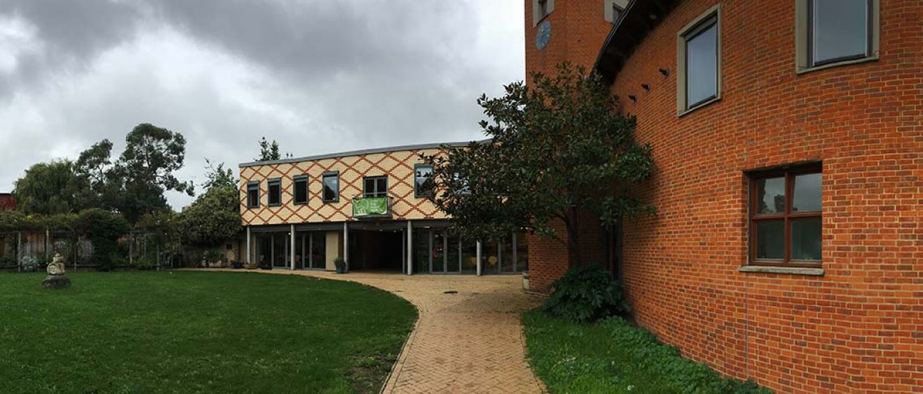 Modern brick building, pathway and grass