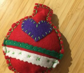finished red felt bauble with blanket stitch edging