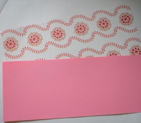 two sheets of different coloured paper