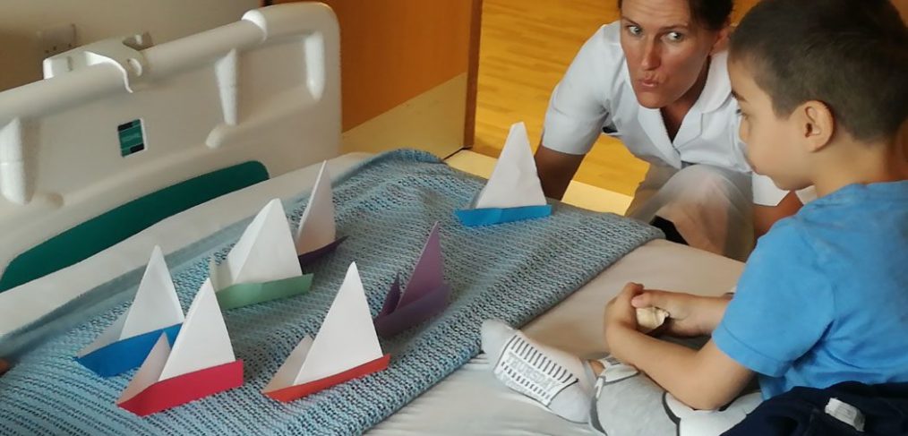 Origami boats on patients bed