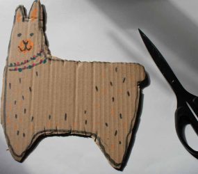 llama shape cut out with five slits top and bottom