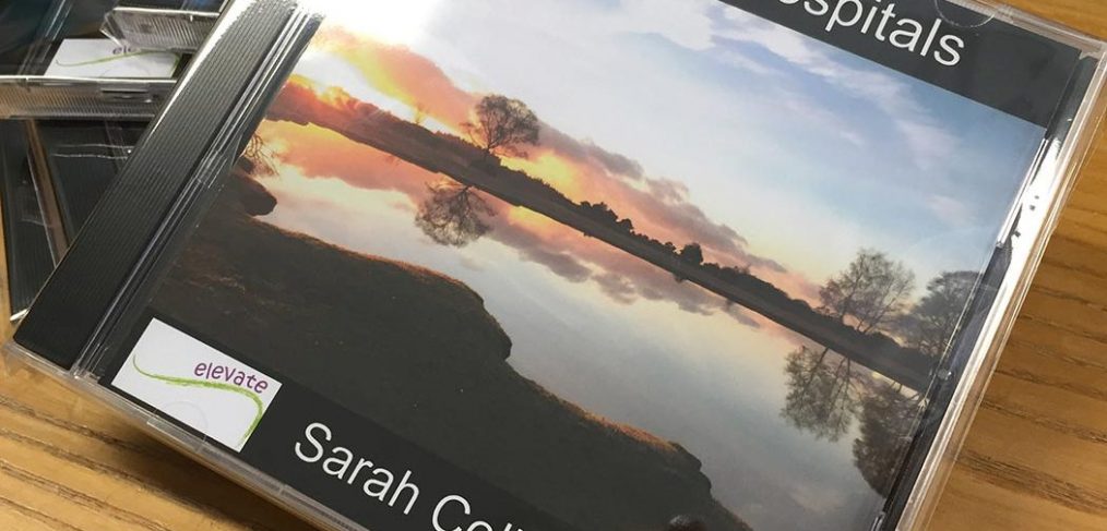 CD cover image of trees reflected in water
