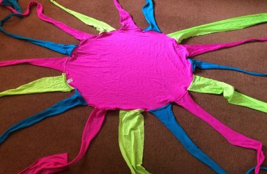 neon lycra circle with coloured tentacles attached