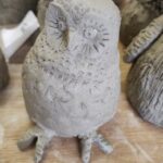 Photograph of owl made from unfired clay
