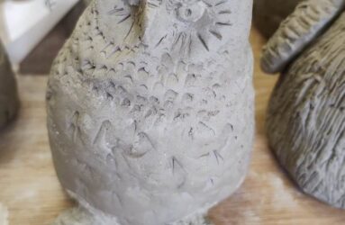 Photograph of owl made from unfired clay
