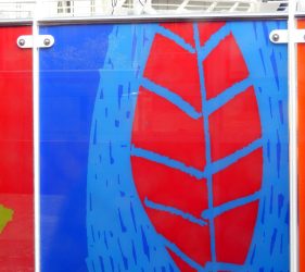 Bright blue glass with red leaf relief design