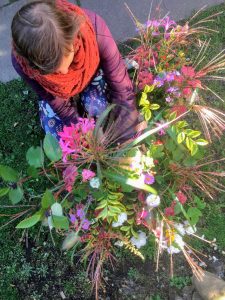 Hannah arranging flowers in basket