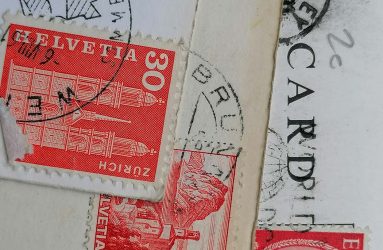 close up of stamps on postcards