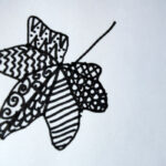 outline of leaf outline in black pen, filled in with zigzag lines and dots
